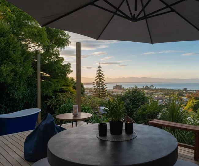 Nelson accommodation with a Tasman Bay view at sunset