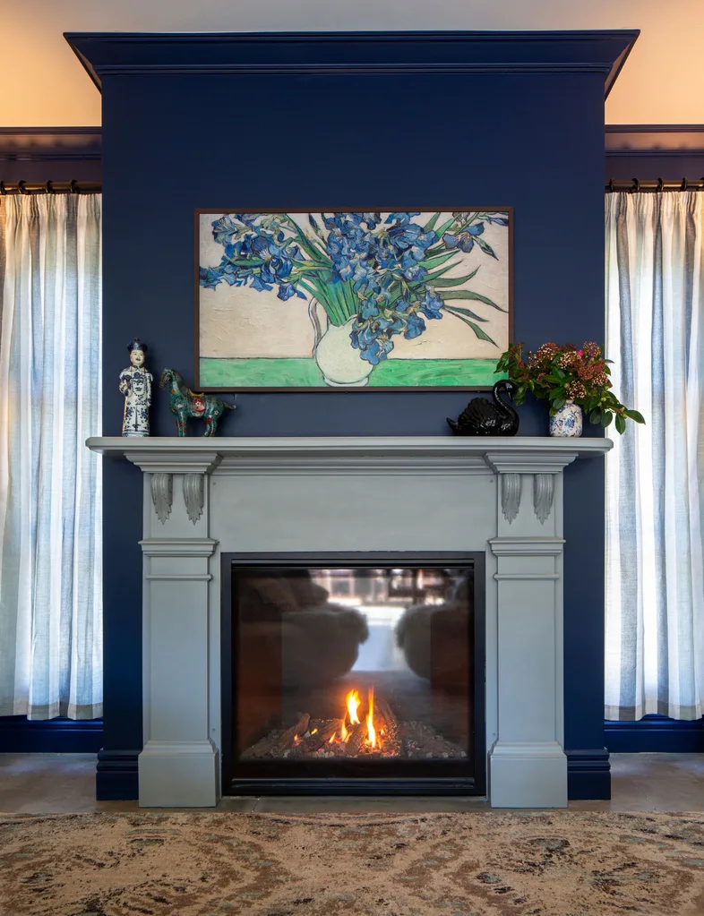 The living room in this Arrowtown home is painted in Resene Blue Night and the fireplace is painted in Resene Tino Pai