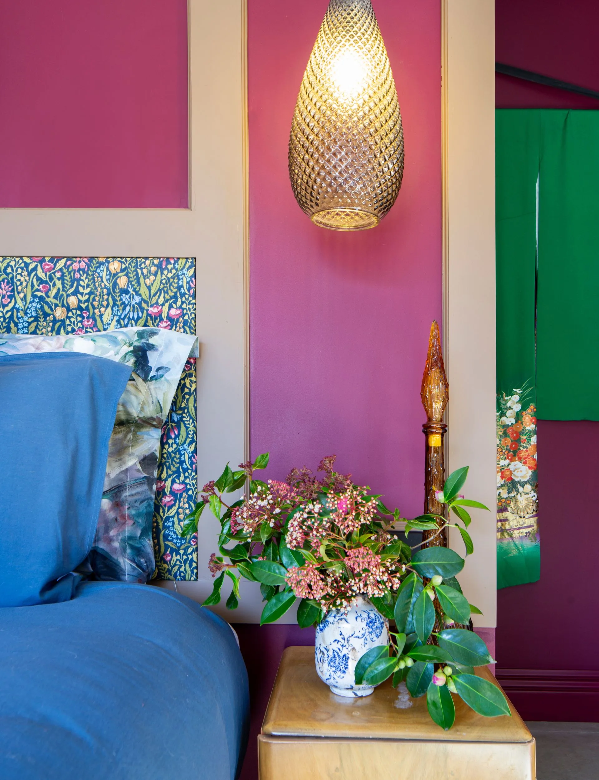 One bedroom in this Arrowtown home is painted in Resene Arthouse, a chic deep red