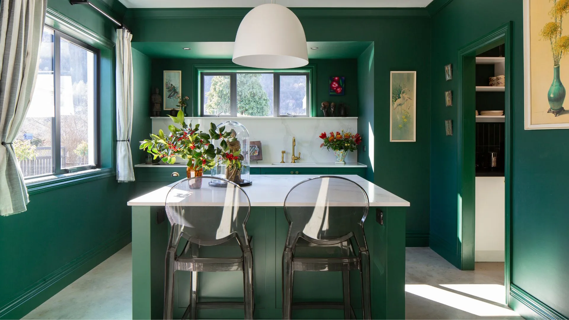 The kitchen in this Arrowtown home is painted in Resene Bush, a traditional palm and everglade green