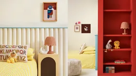 Neutral child's bedroom with pops of blue and red