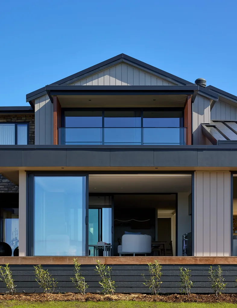 More exterior shots of this home with Vantage floor-to-ceiling windows and sliding doors