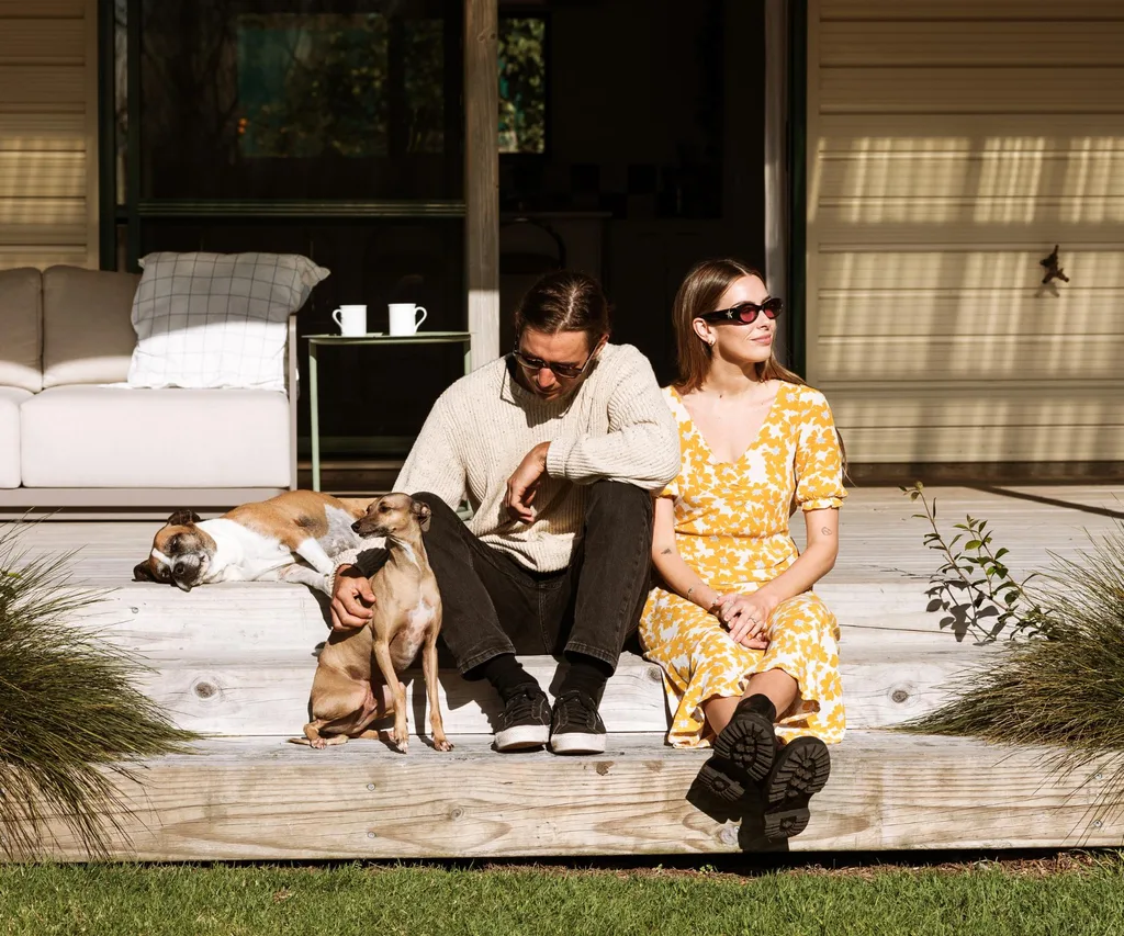 Viarni Bright and partner sitting outside their Te Puke home