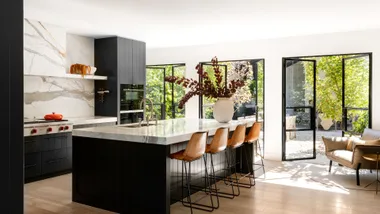 A pavilion home with a sunken firepit and a wine cellar