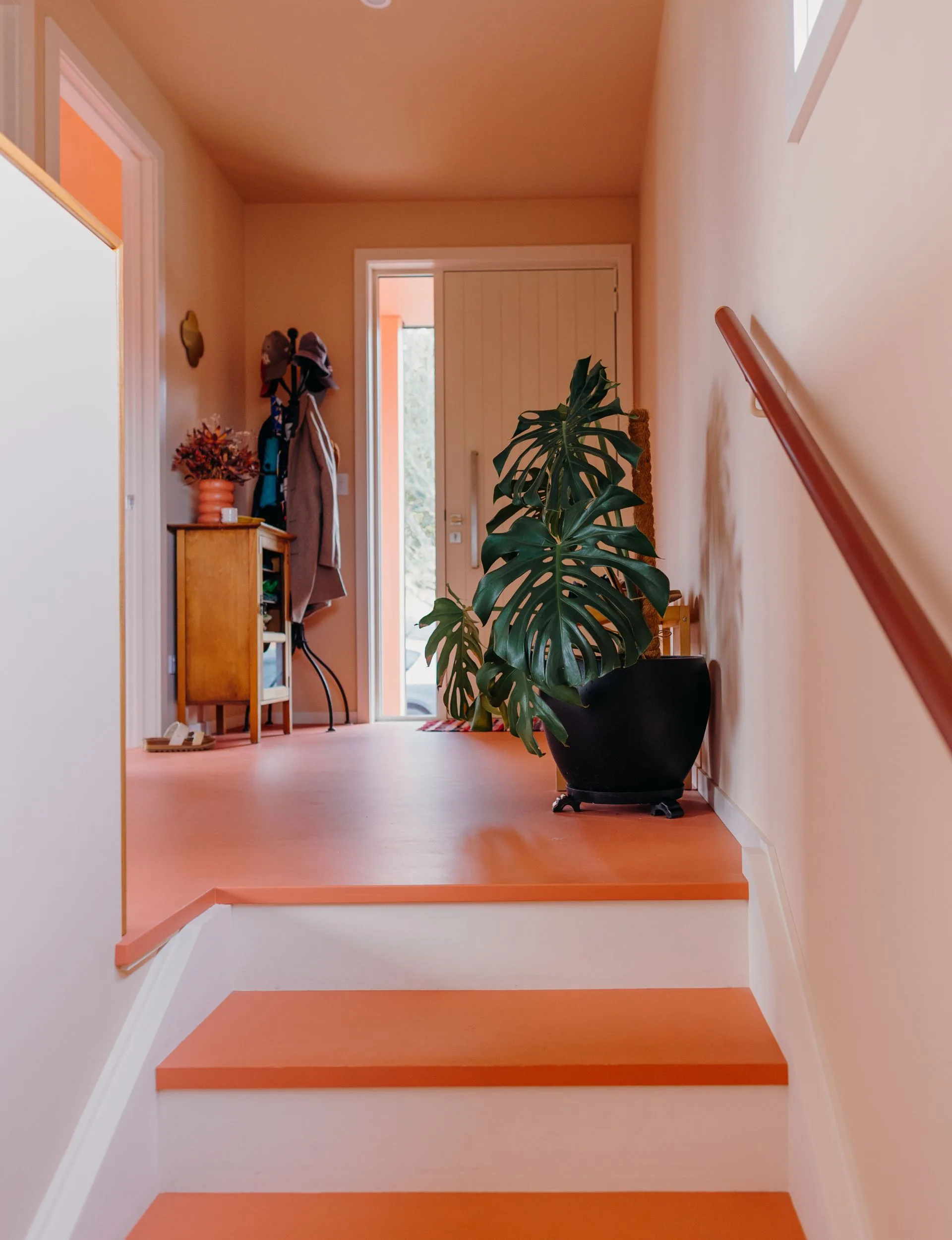 The floorboards of this central Auckland home are painted in a mid-soft red