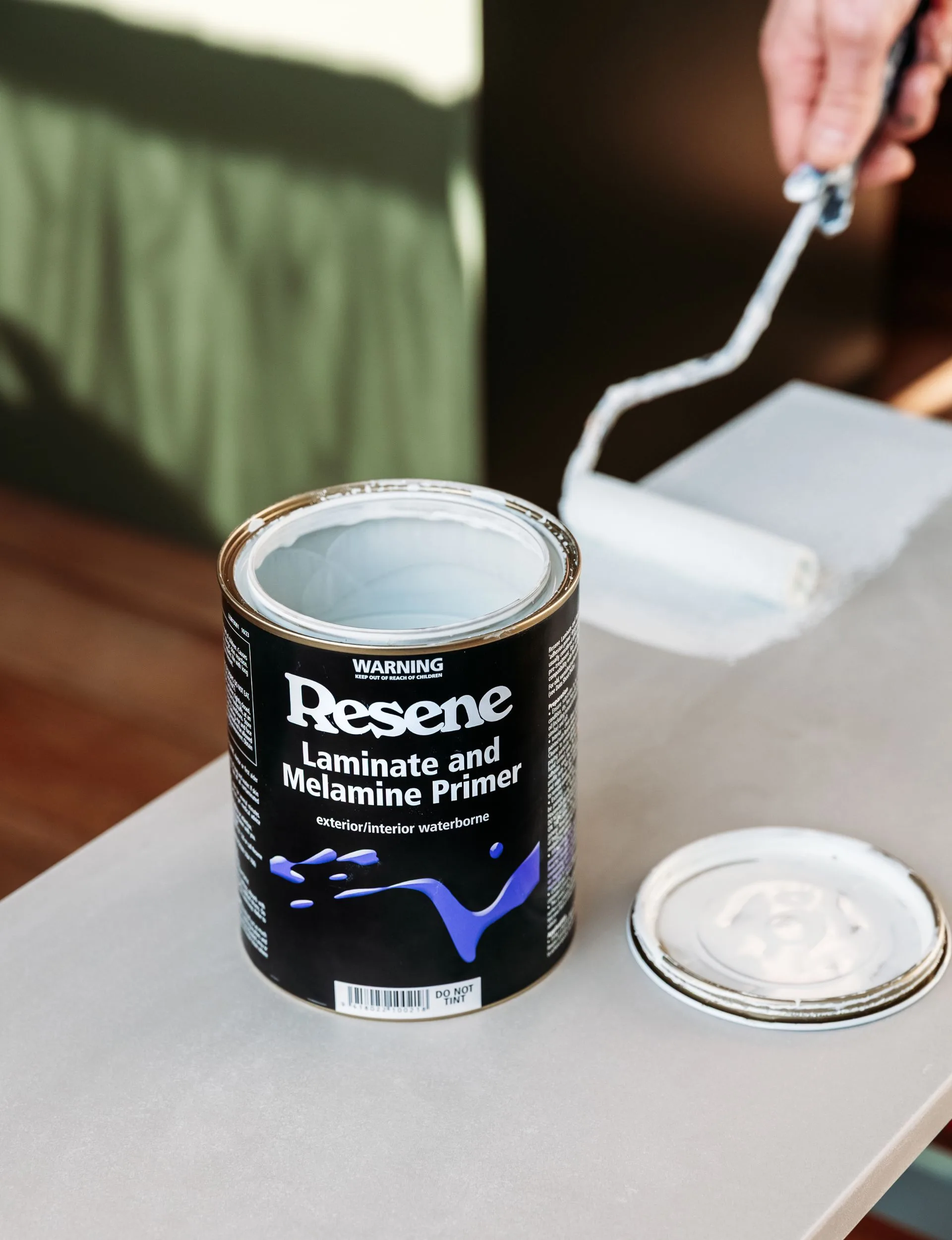 Wipe everything clean and apply a thin coat of Resene Laminate and Melamine Primer