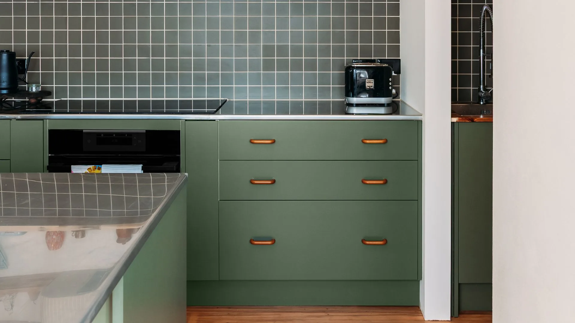 These melamine cupboards were given a fresh coat of green paint