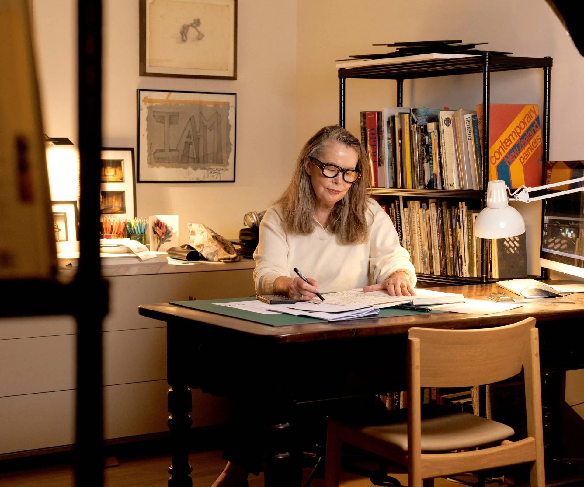 Tracy Grant Lord at her desk in her home office. 