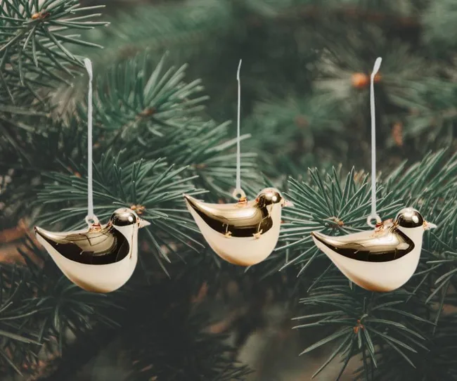 Three gold bird decorations