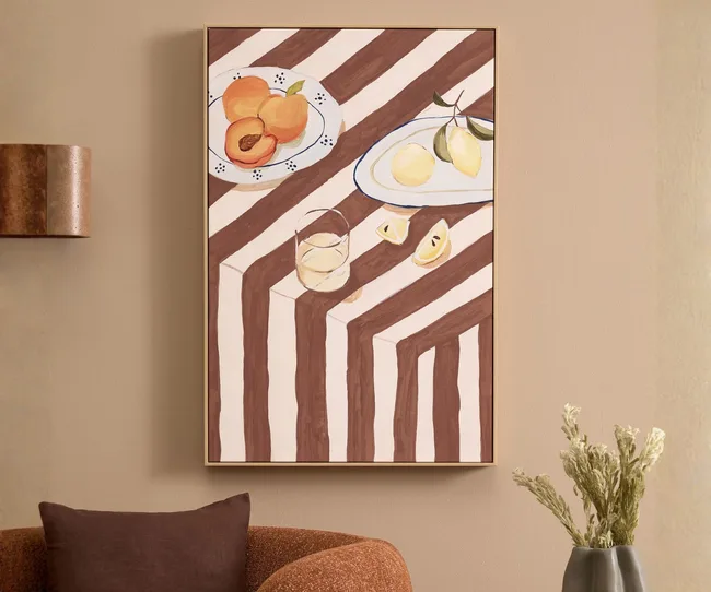 A print with apricots and lemons on a striped background