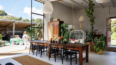 Inside the quirky Auckland barn-home with brass doors & pink kitchen
