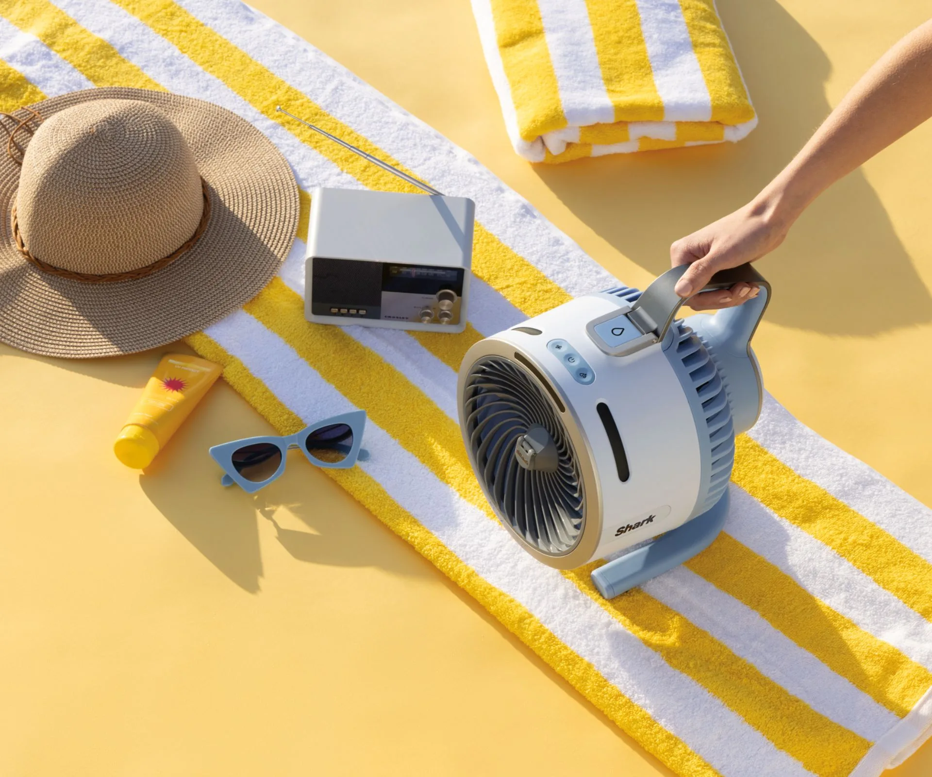 Shark FlexBreeze hydro go fan on a beach towel