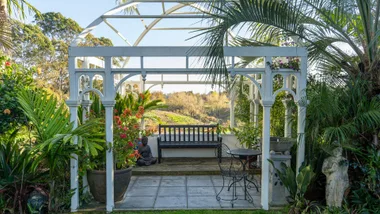 A large pergola in a garden