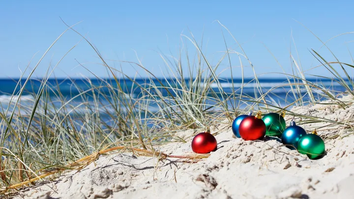 Christmas baubles on a beach