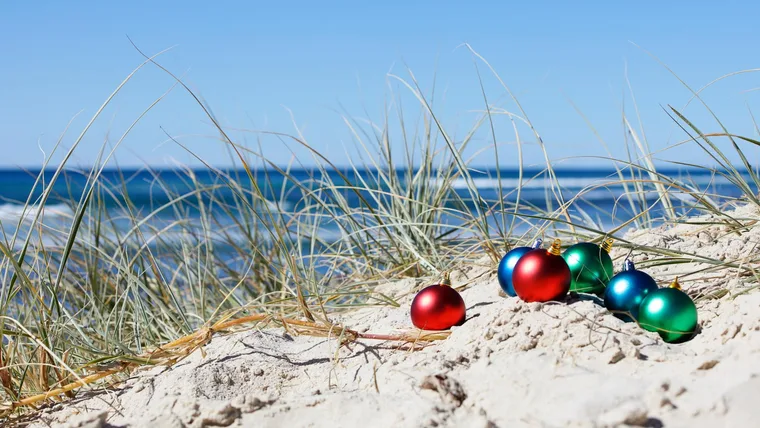 Christmas baubles on a beach
