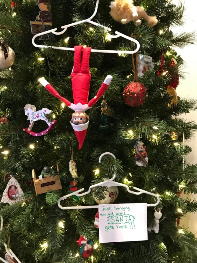 Elf hanging on the Christmas tree
