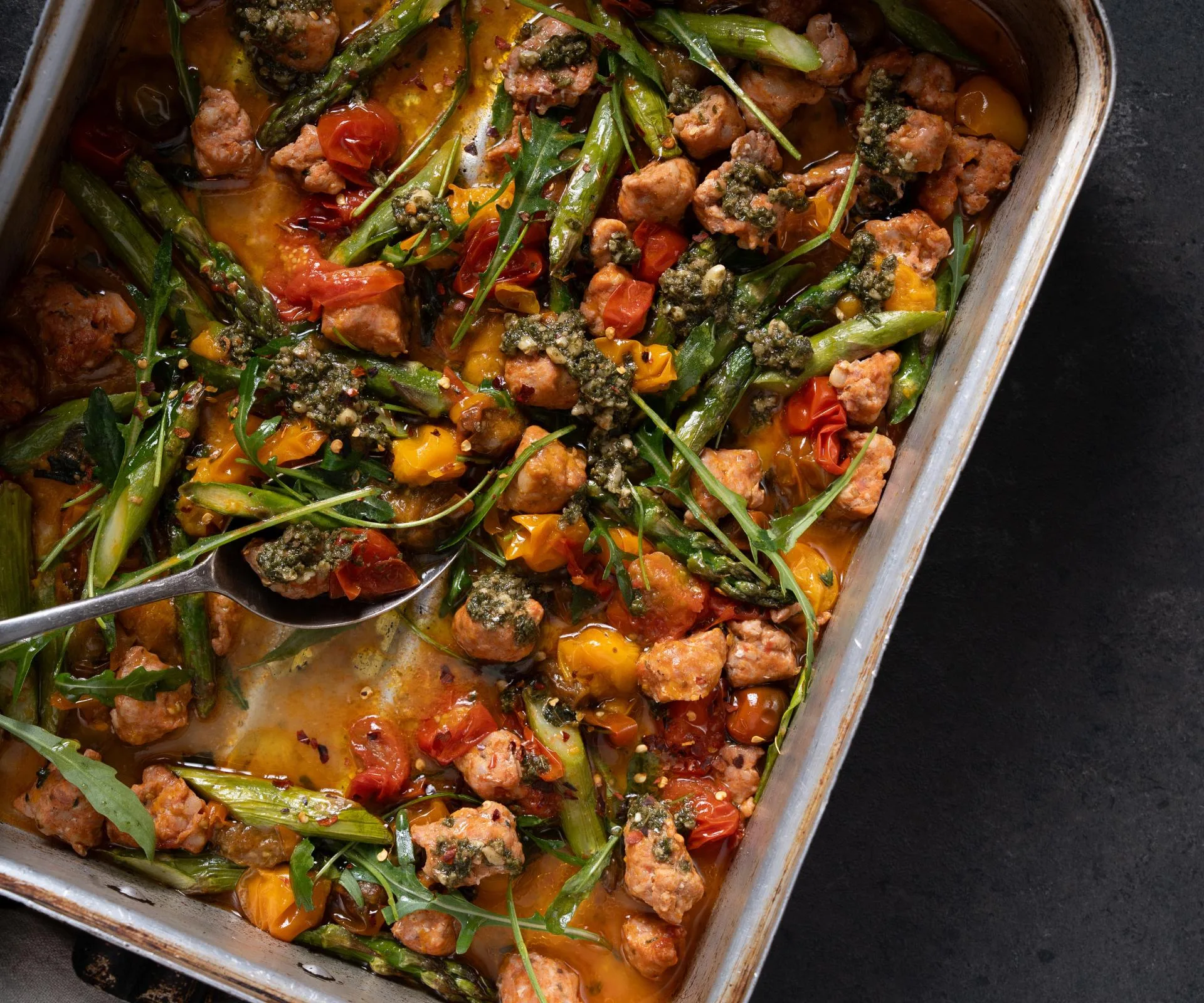 Roasted chorizo, cherry tomato & asparagus tray bake with pesto