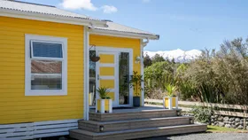 This yellow Waimarino home is the sunniest house on the street