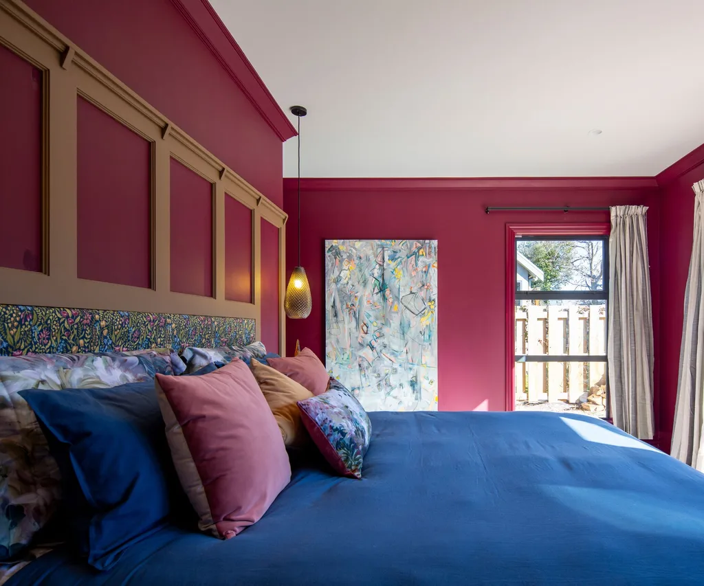 The deep pinot noir colour used in one bedroom is Resene Arthouse