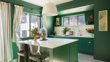 The kitchen in this Arrowtown home is painted in Resene Bush