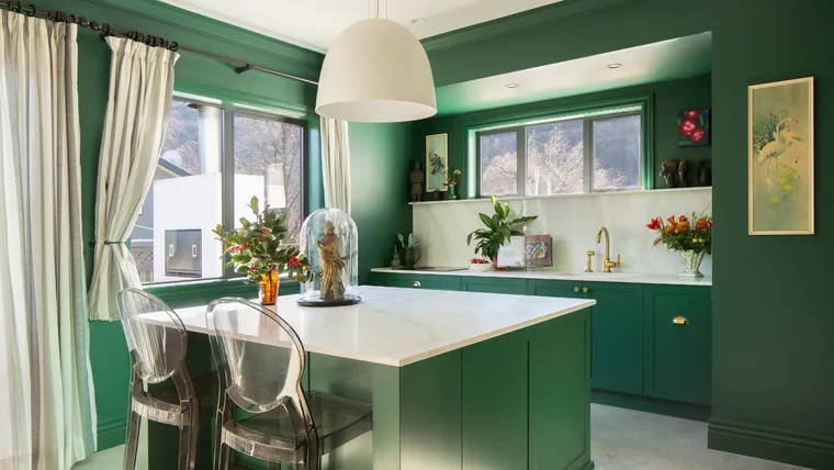 The kitchen in this Arrowtown home is painted in Resene Bush
