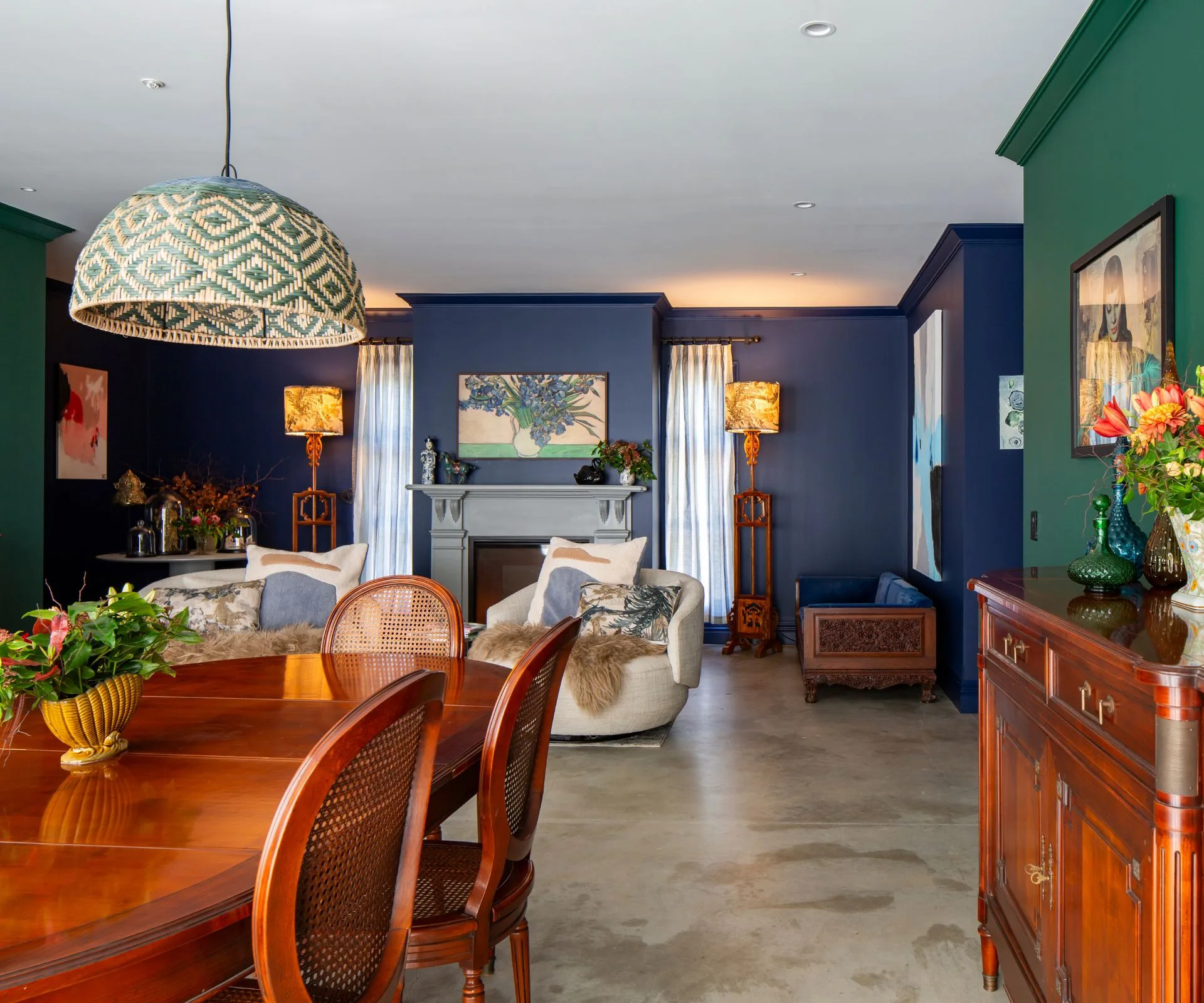 The living room in this Arrowtown home is painted in a deep navy colour