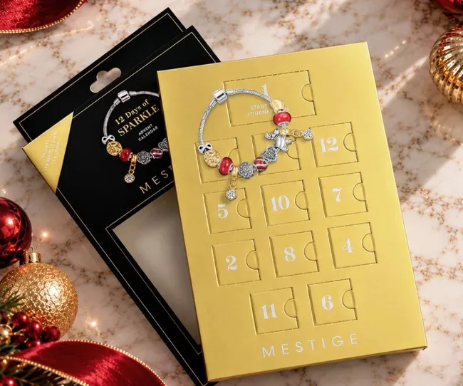 gold box with small foldable windows to show jewllery charms