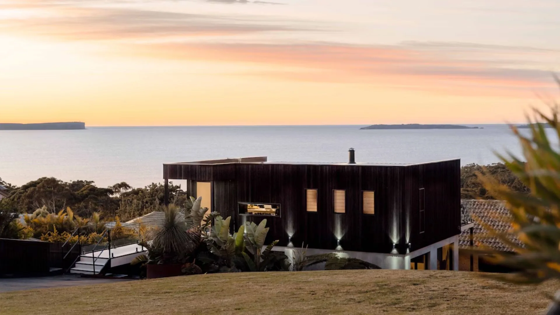 contemporary house overlooking the ocean at sunrise on the south coast