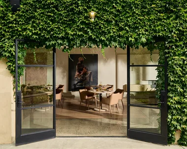 Ivy-covered entrance to LVN Restaurant at Adelaide Hills winery Bird in Hand, showing a peek into the smart, light-filled dining room