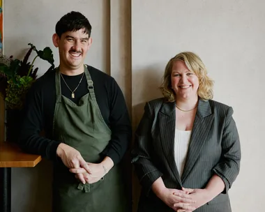 Lorcan Kan and Hannah Green stand together at Etta