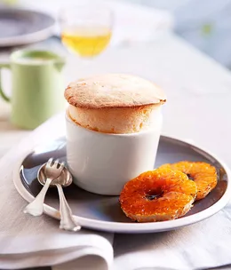Mandarin soufflé with white chocolate sauce