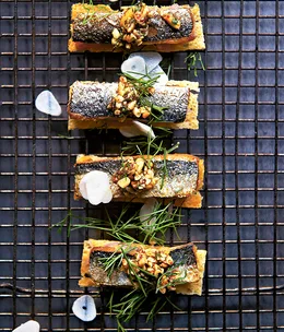 Sardines on toast with sweet onion and pine nut tarator