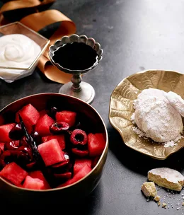 Watermelon, cherry and rose salad with shortbread, yoghurt and cherry syrup