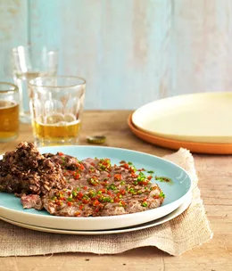 La sabana with refried beans and mule-drivers’ sauce