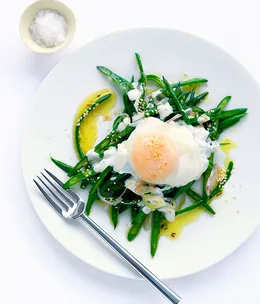 Braised beans with tahini yoghurt and poached egg