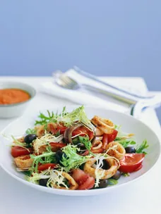 Barbecued squid, endive and olive salad with romesco sauce