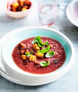 Chilled melon gazpacho with young basil leaves, speck and croûtons
