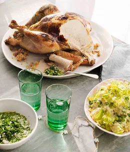 Turkey with cornbread stuffing and potato salad