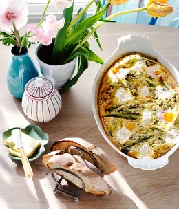 Grilled asparagus, herb and goat’s curd baked eggs