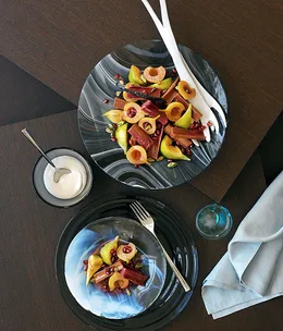 Autumn salad of pomegranate, pear and fig in rhubarb syrup