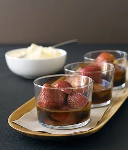 Warm strawberries with black sambuca and mascarpone