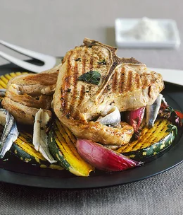 Marinated veal T-bone steaks with grilled pumpkin and anchovies