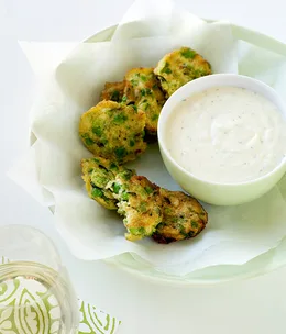 Pea and mint fritters with lemon crème fraîche