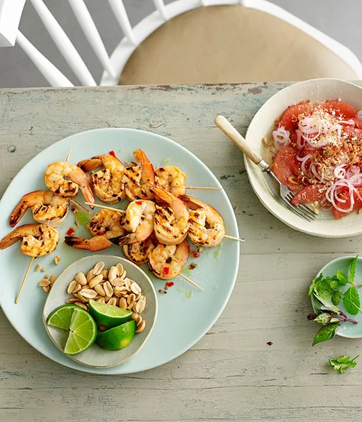 Pink grapefruit and fried shallot salad with grilled lime and chilli prawns