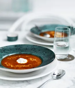 Roast tomato soup with trahanas, Greek-style yoghurt and basil