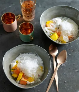 Tropical fruits with ice and salty-sweet coconut milk