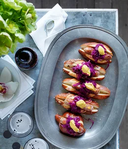 Spiced pork sausages in rolls with red cabbage