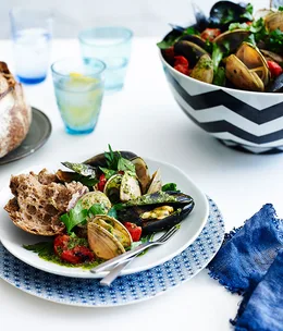 Mussels and clams with grilled tomatoes, butter and herbs