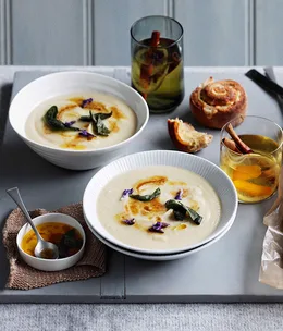 Roast garlic and parsnip soup with lemon butter and sage