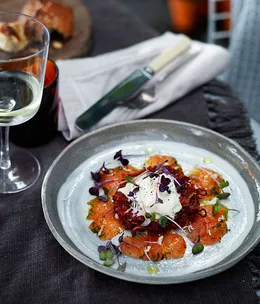 Dill-cured rainbow trout with beetroot and potato cakes and fresh horseradish